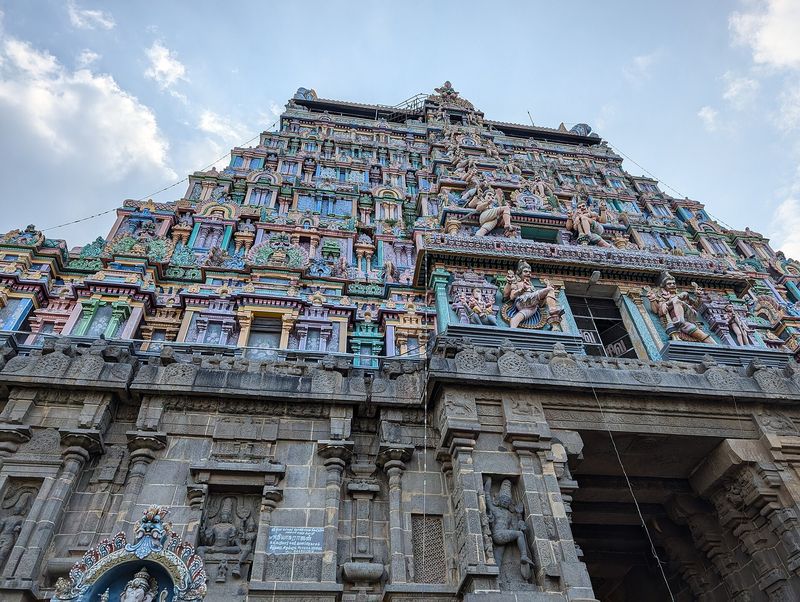 A tall gopuram of the Thillai Nataraja temple at Chidambaram covered in sculpted figures