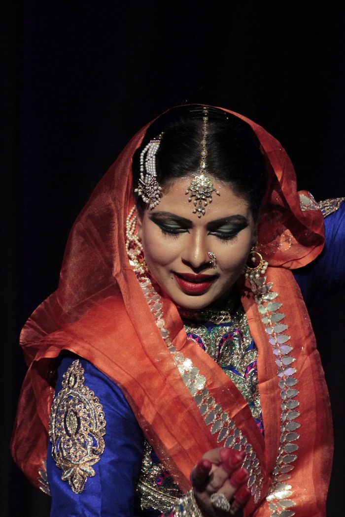 Kathak dancer mid-performance in a flowing costume